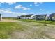 New homes with lush green yards and a view of open fields at 19663 Atwater Ave, Sheridan, IN 46069