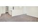 Upstairs hallway with gray carpeting and access to bedrooms at 19663 Atwater Ave, Sheridan, IN 46069