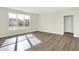 Bright and airy living room with hardwood floors and large window at 19663 Atwater Ave, Sheridan, IN 46069