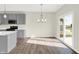Bright dining area with hardwood floors and sliding glass door to backyard at 19663 Atwater Ave, Sheridan, IN 46069