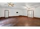 Large living room with hardwood floors and ceiling fans at 7635 Grizzly Dr, Nineveh, IN 46164