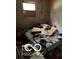 Small bedroom needing renovation. Features a window and wood floors at 2901 S Taft Ave, Indianapolis, IN 46241