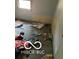 A messy bedroom with damaged flooring and walls at 2901 S Taft Ave, Indianapolis, IN 46241