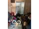 Cluttered bedroom with a suitcase and various items on the floor at 2901 S Taft Ave, Indianapolis, IN 46241