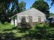Small house needing repairs, boarded windows, brick base at 3318 S Rybolt Ave, Indianapolis, IN 46221