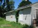 Side view of a small house needing repairs, boarded windows at 3318 S Rybolt Ave, Indianapolis, IN 46221