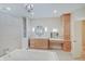 Elegant bathroom with a large soaking tub, double vanity, and ample storage at 3621 Olive Branch Rd, Greenwood, IN 46143
