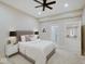 Spacious bedroom with ceiling fan, queen bed, and en-suite bath at 3621 Olive Branch Rd, Greenwood, IN 46143
