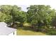 Peaceful pond view with a house and lush green lawn at 3621 Olive Branch Rd, Greenwood, IN 46143