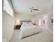 Bright bedroom with ceiling fan and plush queen-size bed at 3621 Olive Branch Rd, Greenwood, IN 46143
