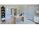 Bright home office with built-in shelving and a large workspace at 3621 Olive Branch Rd, Greenwood, IN 46143