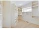 Spacious walk-in closet with custom shelving and a window at 3621 Olive Branch Rd, Greenwood, IN 46143