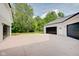 Three-car garage with spacious driveway and landscaping at 3621 Olive Branch Rd, Greenwood, IN 46143