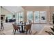 Bright dining area with sliding glass doors leading to a deck and backyard at 3621 Olive Branch Rd, Greenwood, IN 46143