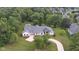 Aerial view of home, pool, and lush green landscape at 3621 Olive Branch Rd, Greenwood, IN 46143
