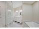 Spa-like bathroom with a large shower, double vanity, and soaking tub at 3621 Olive Branch Rd, Greenwood, IN 46143