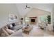 Spacious living room with a cozy fireplace and large windows at 3621 Olive Branch Rd, Greenwood, IN 46143