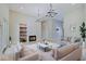 Open living room with large windows and a cozy fireplace at 3621 Olive Branch Rd, Greenwood, IN 46143