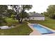 Luxury pool with lounge chairs and landscaping; near pond and house at 3621 Olive Branch Rd, Greenwood, IN 46143