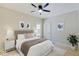 Spacious bedroom with queen bed, ceiling fan, and ample natural light at 3621 Olive Branch Rd, Greenwood, IN 46143