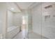 Spa-like bathroom with soaking tub and walk-in shower at 3621 Olive Branch Rd, Greenwood, IN 46143