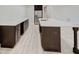 Large kitchen island with dark cabinetry and white quartz countertops at 3621 Olive Branch Rd, Greenwood, IN 46143