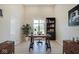 Modern home office with a large window, built-in shelving and a desk at 3621 Olive Branch Rd, Greenwood, IN 46143