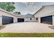 View of three-car garage with modern design at 3621 Olive Branch Rd, Greenwood, IN 46143