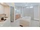 Spa-like bathroom with a soaking tub, walk-in shower, and modern cabinetry at 3621 Olive Branch Rd, Greenwood, IN 46143