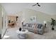 Elegant living room with a large sectional sofa, coffee table, and access to a patio at 3621 Olive Branch Rd, Greenwood, IN 46143