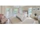 Bright bedroom with a plush bed, large windows, and access to a private deck at 3621 Olive Branch Rd, Greenwood, IN 46143