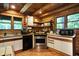 Rustic kitchen with wood cabinets, ample counter space, and stainless steel appliances at 9307 E Dill Rd, Morgantown, IN 46160