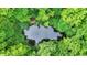 Secluded pond surrounded by lush forest at 9307 E Dill Rd, Morgantown, IN 46160