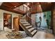 Unique staircase with stone planter and wall decor at 9307 E Dill Rd, Morgantown, IN 46160