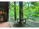 Deck with tree growing through it, offering tranquil views at 9307 E Dill Rd, Morgantown, IN 46160