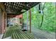 Large deck overlooking a lush, wooded area at 9307 E Dill Rd, Morgantown, IN 46160