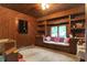 Charming wood-paneled office with built-in shelving and window seat at 9307 E Dill Rd, Morgantown, IN 46160