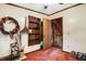Bedroom with built-in shelving and access to loft at 9307 E Dill Rd, Morgantown, IN 46160
