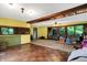 Sunroom with tiled floor, wood ceilings and large windows at 9307 E Dill Rd, Morgantown, IN 46160