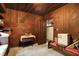 Wood paneled bedroom with built-in shelving and window seat at 9307 E Dill Rd, Morgantown, IN 46160