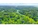 Expansive wooded area with a winding creek at 9307 E Dill Rd, Morgantown, IN 46160