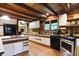 Rustic kitchen with wood cabinets, island, and stainless steel appliances at 9307 E Dill Rd, Morgantown, IN 46160