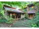 Log and stone home nestled in woods at 9307 E Dill Rd, Morgantown, IN 46160
