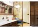 Clean bathroom with a pedestal sink and vintage blue toilet at 9307 E Dill Rd, Morgantown, IN 46160