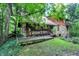 Log cabin home nestled in a lush forest setting at 9307 E Dill Rd, Morgantown, IN 46160