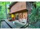Deck with stone and wood exterior and wooded views at 9307 E Dill Rd, Morgantown, IN 46160