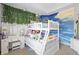 bedroom with bunk beds, vanity, and beach mural at 11988 Windpointe Pass, Carmel, IN 46033