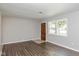 Bright living room featuring hardwood floors and a large window at 975 Rolling Hill Rd, Greenwood, IN 46142