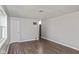 Empty living room with hardwood floors and large windows at 975 Rolling Hill Rd, Greenwood, IN 46142