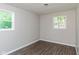 Simple bedroom with hardwood floors and neutral walls at 975 Rolling Hill Rd, Greenwood, IN 46142